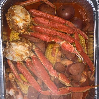 King crab legs with corn and potatoes in Kimkey sauce