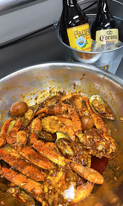 Family-style seafood boil with mussels, shrimp and beer