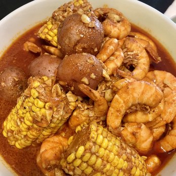 Shrimp, corn and potatoes in spicy Kimkey sauce